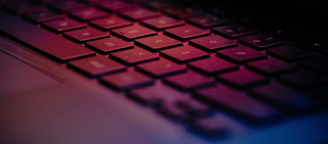 a-close-up-of-a-keyboard-with-a-blurry-background