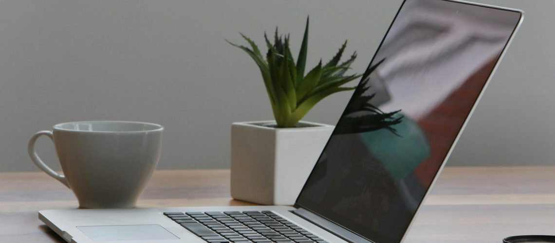 7-Ways-Using-AI-for-Work-Can-Get-Complicated-scaled.jpg Free Minimalist home office desk with laptop, smartphone, and plant for a modern work environment. Stock Photo