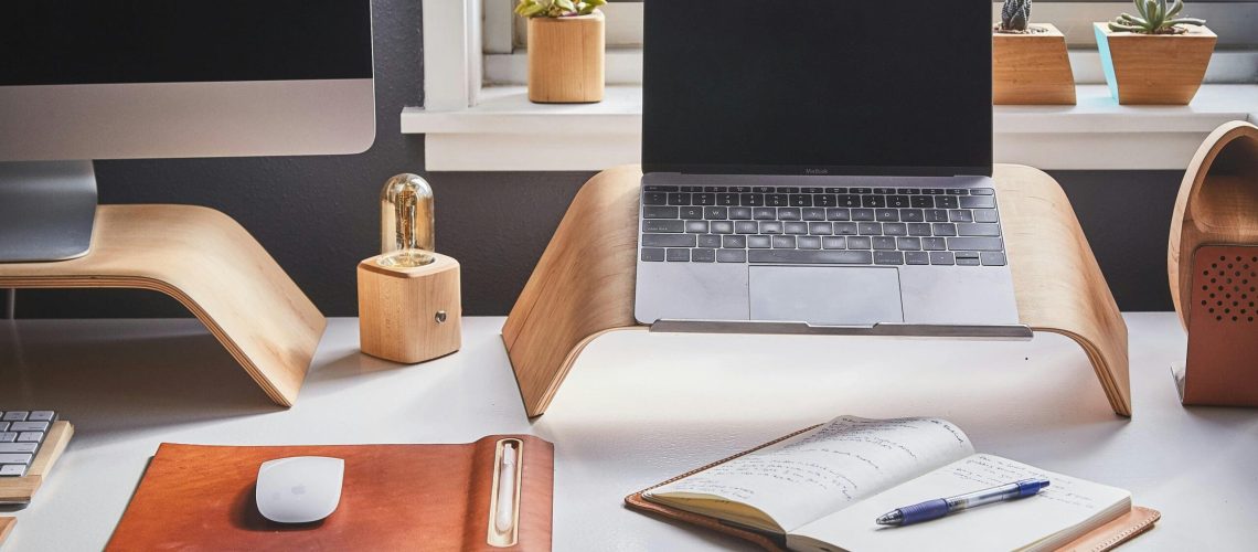 Free A stylish and contemporary home office setup with laptop and desk accessories. Stock Photo