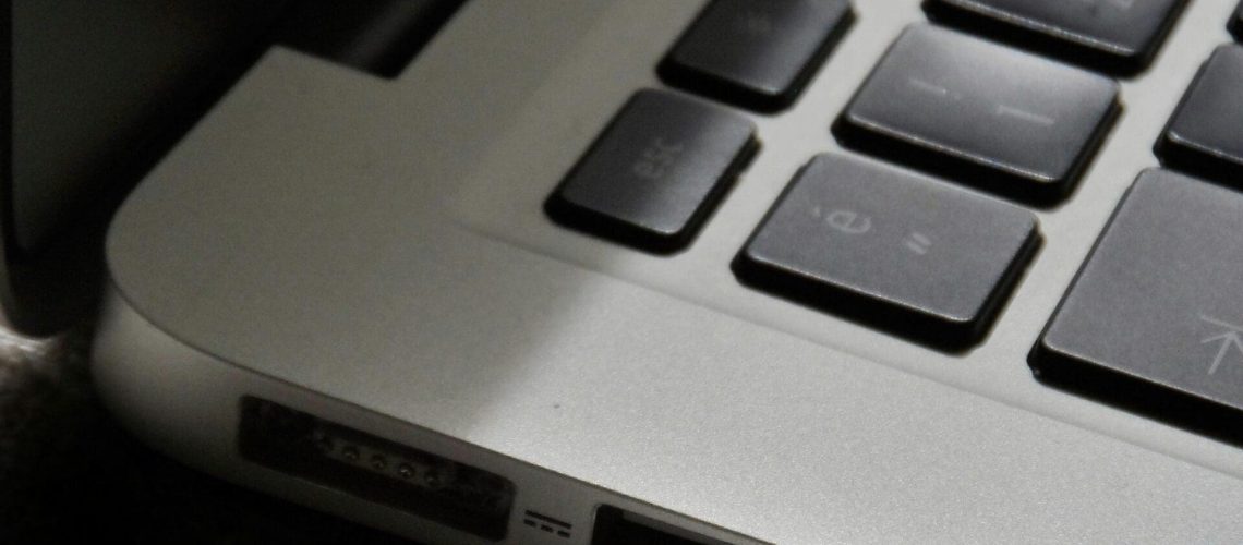 Free Detailed view of a silver laptop showing keyboard and multiple ports. Stock Photo