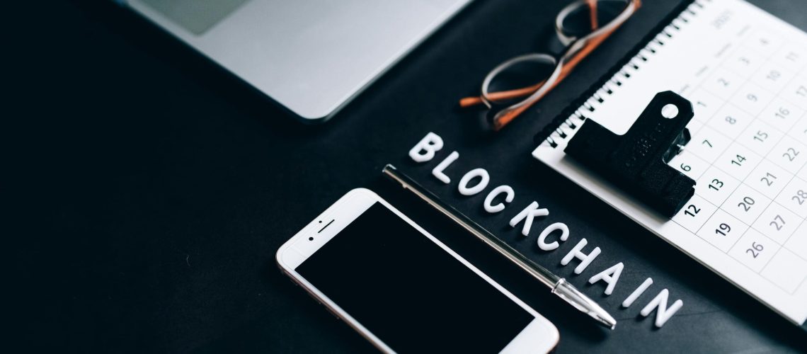What-is-Blockchain-Technology-and-How-Does-it-Work_-scaled.jpg Free Flat lay of a modern digital workspace with blockchain theme, featuring a smartphone and calendar. Stock Photo
